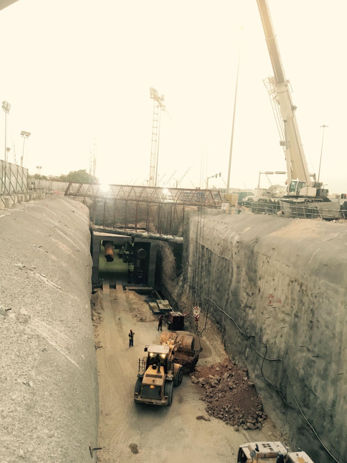 Underground tunnel cavern night excavation with excavators